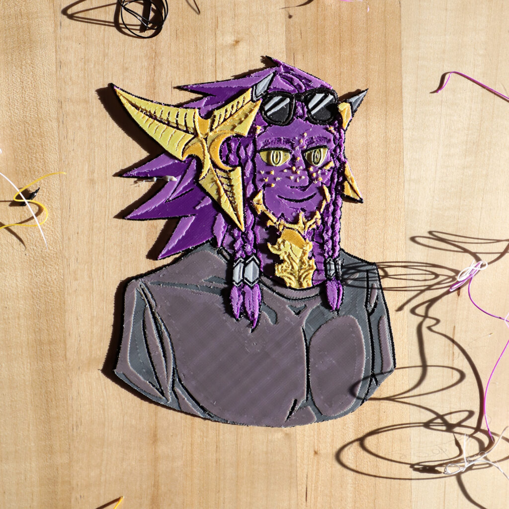 A 3D print of a character with a purple face, gold features, and sunglasses